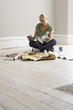 Woman decorating, looking at colour swatches