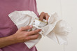 Man packing tea cup, close-up