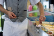Waiter preparing ice cream dessert, mid section