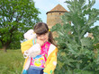 Photo: Little girl with a toy bear-cub and prickly plant. Little girl with a toy bear-cub and prickly plant.