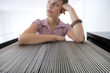 Businesswoman by filing cabinet