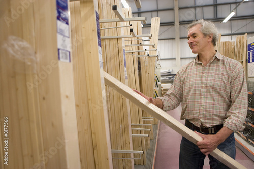 Photo: Man shopping in hardware store Man shopping in hardware store
