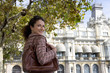Woman standing outdoors in urban setting