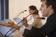Businessman speaking into microphone at conference