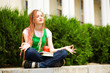 student meditating outdoors