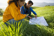 A couple reading a map.