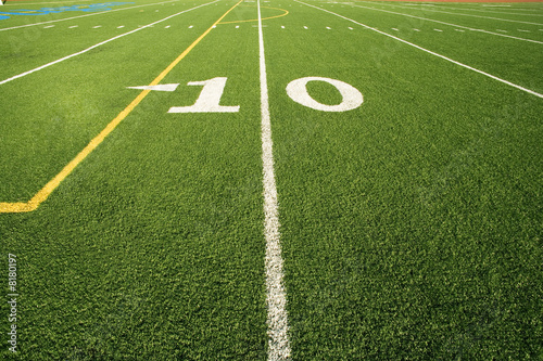 Photo: Close up of the 10 yard line in football field Close up of the 10 yard line in football field