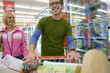 Couple grocery shopping in frozen foods section