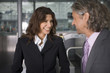 A businessman talking to the ground staff at the airport.