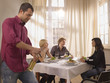 Two couples having a meal together.