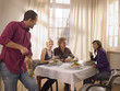 Two couples having a meal together.