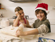 Brother and sister baking cookies.