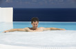 Foto: A man relaxing in a jacuzzi A man relaxing in a jacuzzi