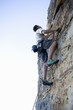 A climber climbing a rock face