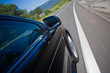 car driving fast on a road