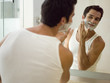 A man applying shaving foam.