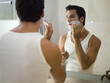 A man applying shaving foam.