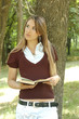 Woman reading a book in the park