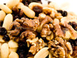Close Up Walnuts Peanuts and Dried Fruit on White Background