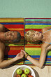 Couple lying down beside the pool.