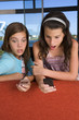 Sisters using their mobile phones