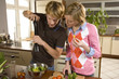 Couple making salad.