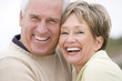 Couple at the beach smiling