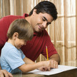 Dad helping son.