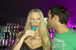 Couple standing at a bar counter