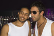 Close-up of two young men in a nightclub
