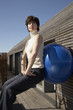 Mature woman exercising with a fitness ball