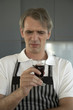 Mid adult man holding a glass of red wine