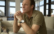 Man sitting with his hands clasped