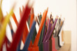 Photo: Row of multi-coloured colouring pencils in pots, close-up (still life, differential focus) Row of multi-coloured colouring pencils in pots, close-up (still life, differential focus)