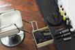 Barber's chair beside open draw of hair products, scissors and hairbrushes in salon, overhead view