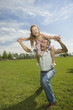 Happy father with daughter on his shoulders