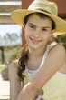 Portrait of young girl in hat