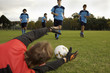 Soccer players playing soccer