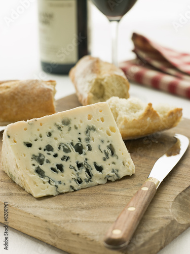 Photo: Wedge of Roquefort Cheese with Rustic Baguette and Red Wine Wedge of Roquefort Cheese with Rustic Baguette and Red Wine