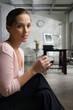 Photo: Side profile of a young woman using a personal data assistant Side profile of a young woman using a personal data assistant