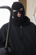 Man wearing balaclava and holding crowbar