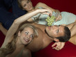 Young man flirting with two young women