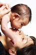 Mommy smooching with baby isolated
