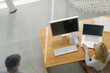 High angle view of a businesswoman working on a laptop in an office