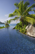 Photo: Swimming pool of the Banyan Tree Hotel with ocean in background, Anse Intendance, Mahe', Seychelles Swimming pool of the Banyan Tree Hotel with ocean in background, Anse Intendance, Mahe', Seychelles