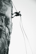 A climber climbing a rock face