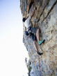 A climber climbing a rock face