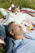 Husband and wife resting in park