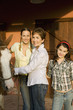 Three generation family with horse