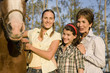 Three generation family with horses